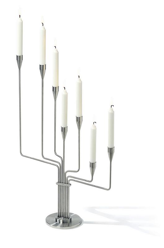 During a stay in the southern hemisphere Piet Hein was missing The Great Bear in the sky. This privation inspired him to create a seven branched candelabra which could bring back his thoughts to Denmark and the north. It was the idea behind this candelabra which has now been manufactured according to his elegant design using the finest danish quality materials.